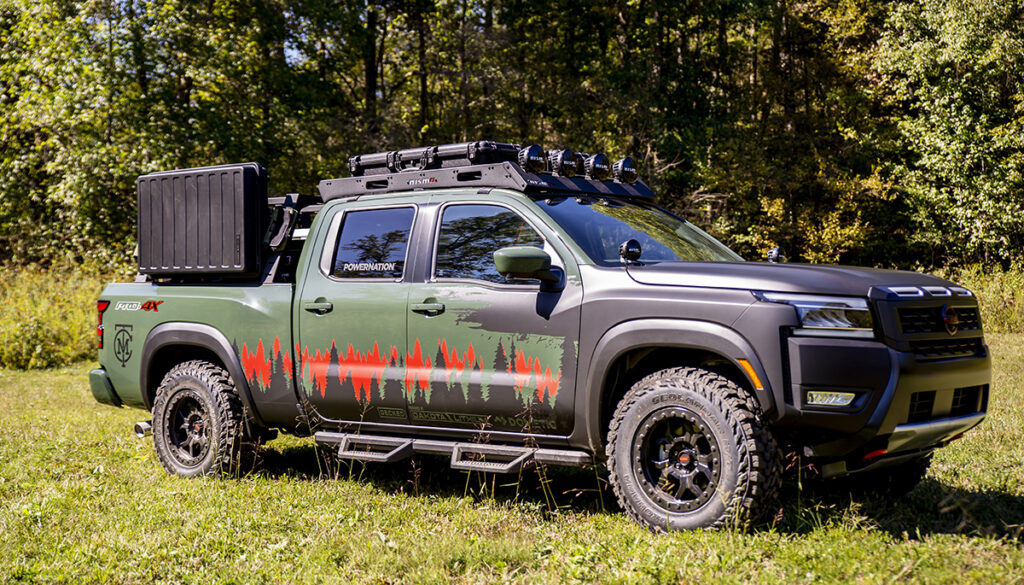 Nissan Project Trailgater parked on grass in front of trees