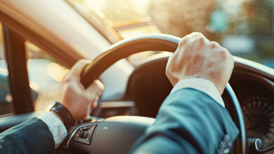 Two hands on steering wheel