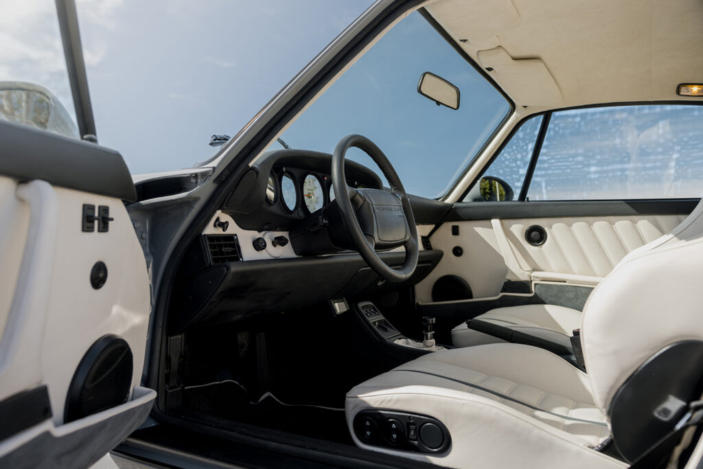 Interior through open door of Electrified Porsche 911 (964)