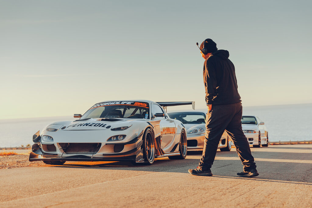 Jonny Grunwald walking to his FD RX7