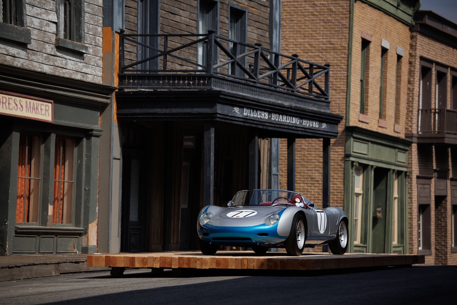 porsche on studio lot in front of storefronts