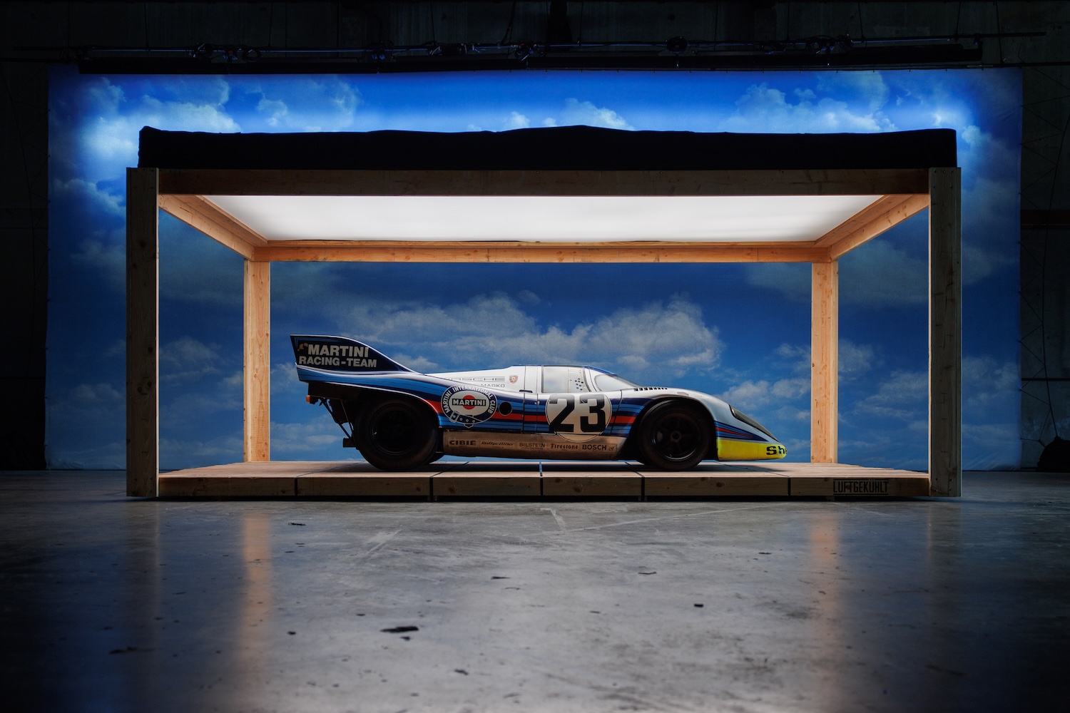 Race porsche displayed in a box frame