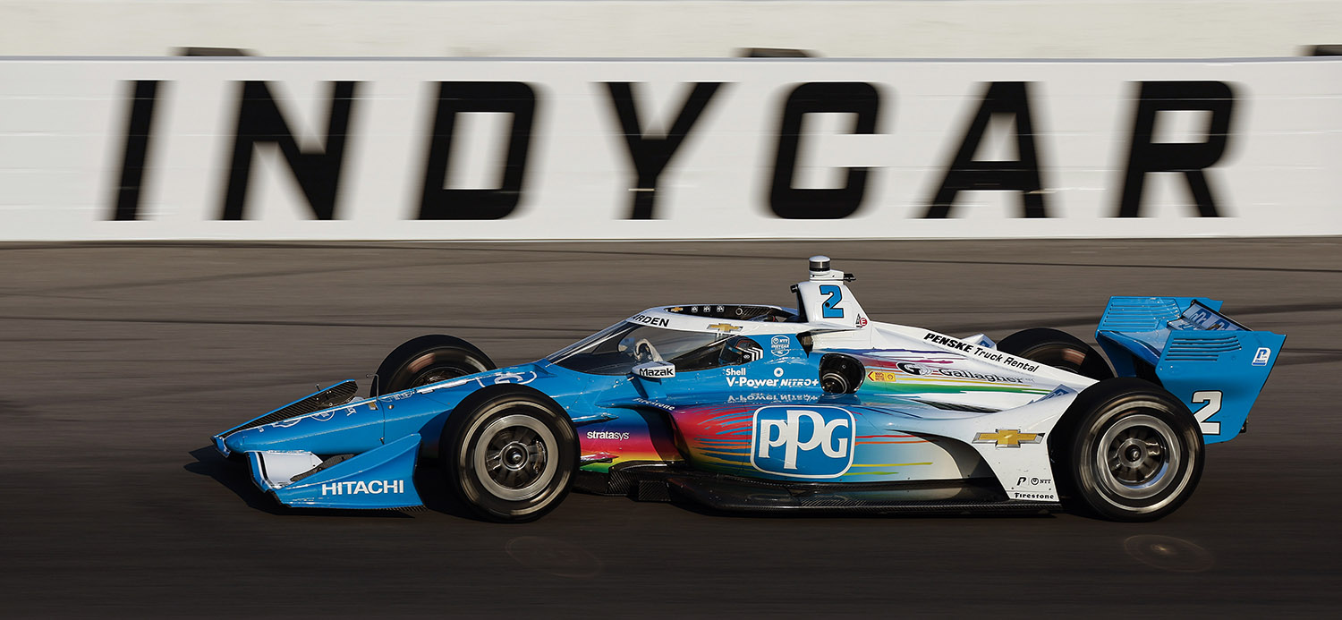 PPG logo on No 2 Team Penske Chevrolet racing on track