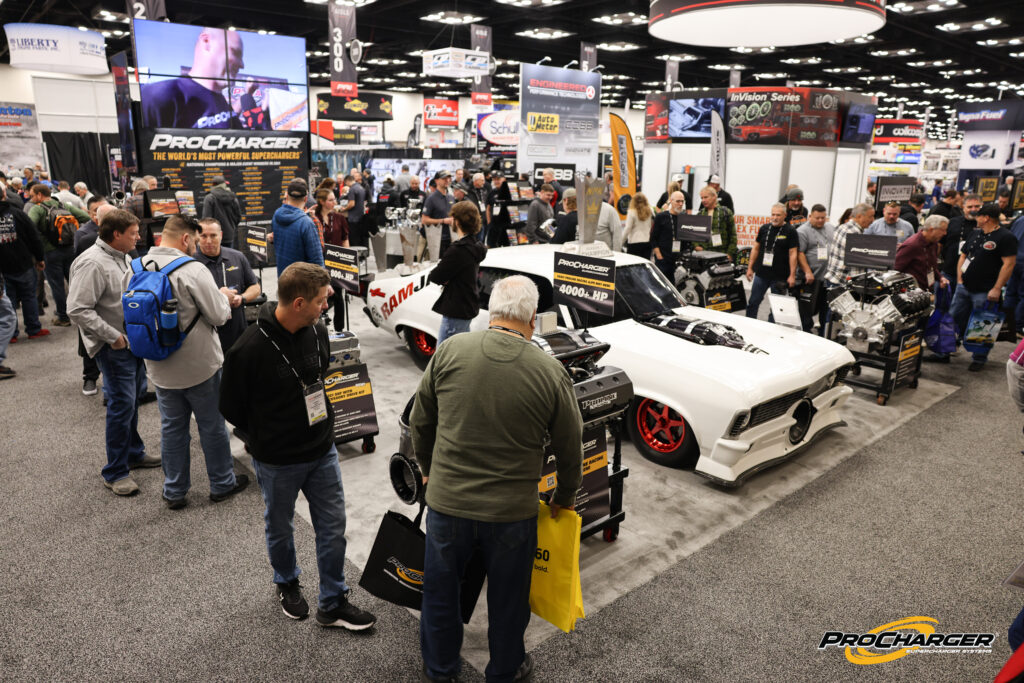 white drag car in procharger pri booth