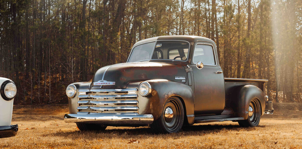 SC31T Chevy 3100 restomod pickup parked in front of trees