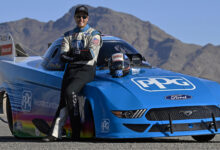 Bob Tasca III leaning against PPG Nitro Mustang Funny Car