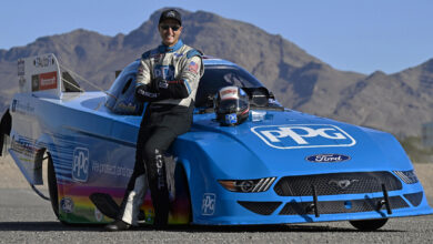 Bob Tasca III leaning against PPG Nitro Mustang Funny Car