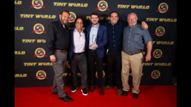 Tint World Stage with franchise owners accepting award