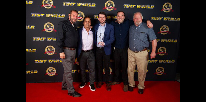 Tint World Stage with franchise owners accepting award