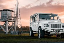 ECD Auto Design Project Blanca parked in front of old water tower and windmill