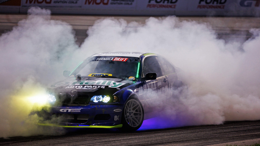 Car and smoking tires during Formula DRIFT event