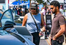 People looking at EV at Electrify Expo