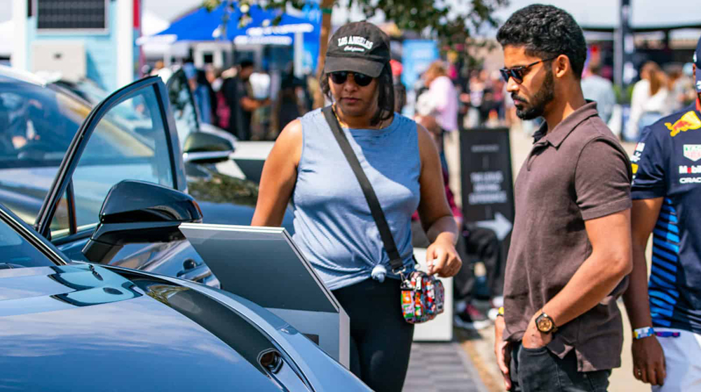 People looking at EV at Electrify Expo