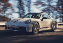 Porsche 911 driving on road