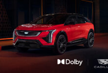 Red Cadillac EV with Dobly and Cadillac logos