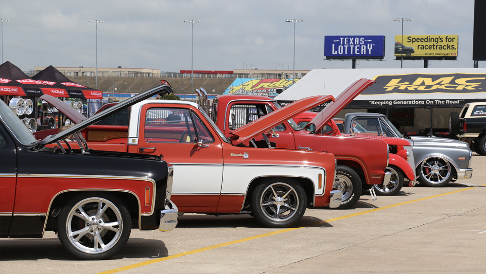 Row of trucks with open hoods at Goodguys 2024 Spring Lone Star National event