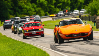2024 hot rod power tour with a line of cars driving on road