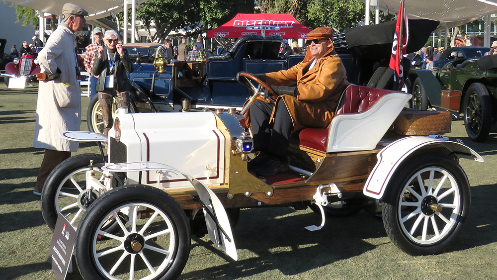 A period-costumed Alan Travis in his rare 1906 Sizaire Naudi d'Course