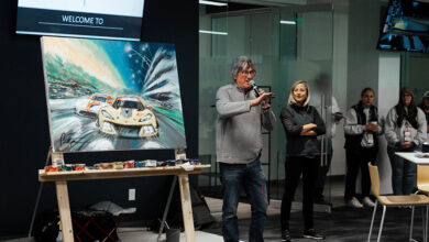 Bill Patterson presenting painting at auction for Austin Hatcher Foundation
