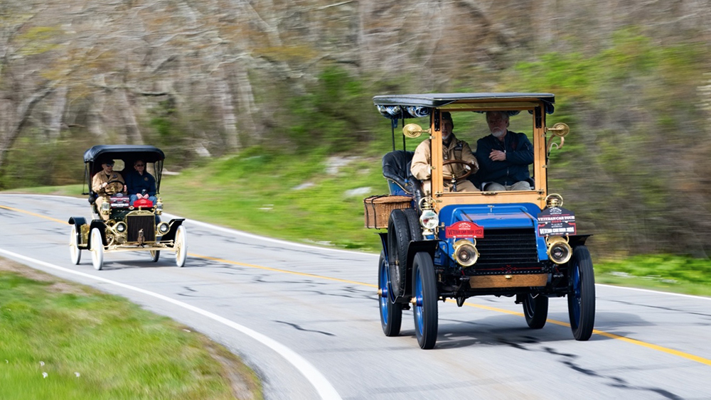 Cars driving on the road for the Audrain Veteran Car Tour