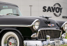 Classic car parked in front of Savoy Automobile Museum