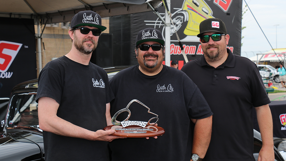 Custom 1933 Willys coupe owner Dave Kroona holding award