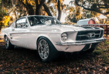 ECD Automotive Design Project ‘67 Ghost-a 1967 Mustang Fastback parked under trees in front of barn
