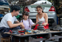 Asian family of mechanic enjoy to have good activity together in