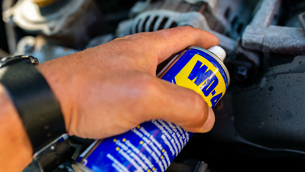 Mechanic using WD-40
