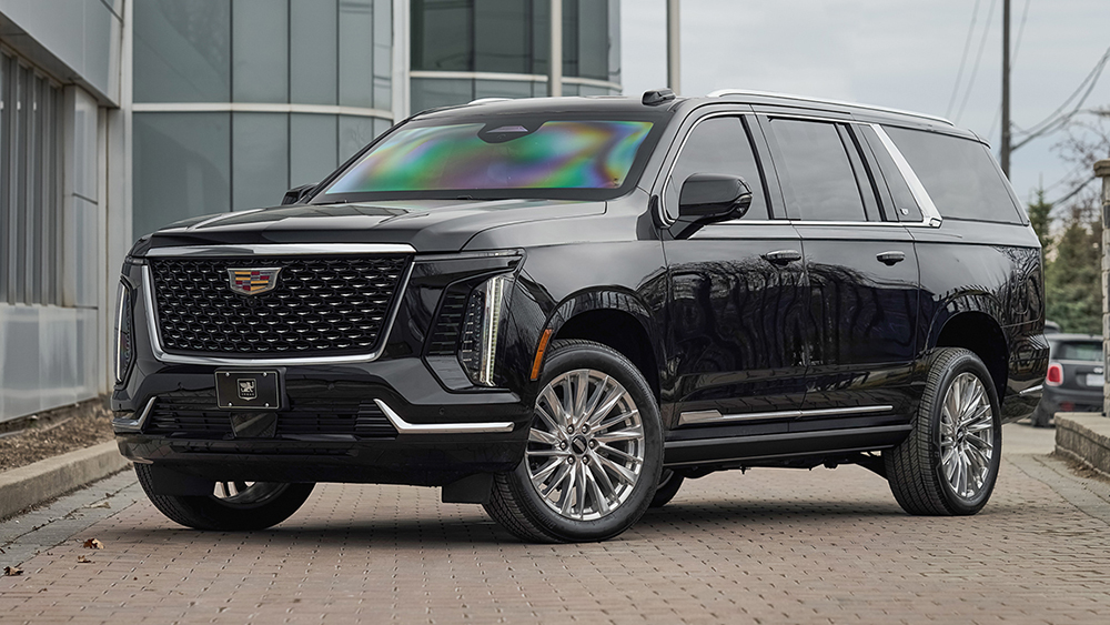 INKAS All-New 2025 Armored Cadillac Escalade parked in front of building