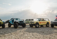 Jeeps parked on a beach