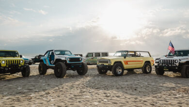 Jeeps parked on a beach