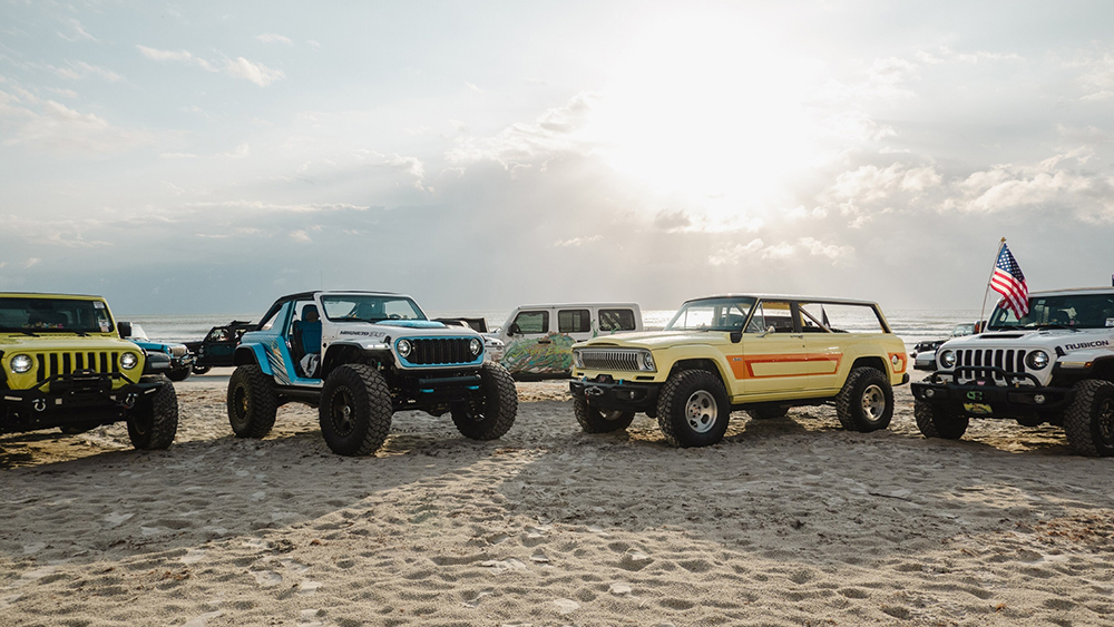 Jeeps parked on a beach