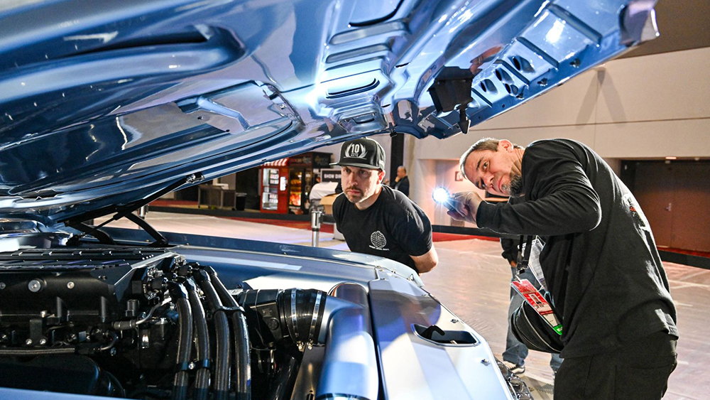 Judges inspecting car at SEMA Battle of the Builders