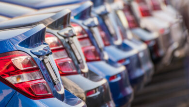 Row of brand-new vehicles from rear