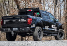 Team Rubicon F-150 from rear parked on gravel