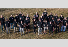 The people of AWE standing in field