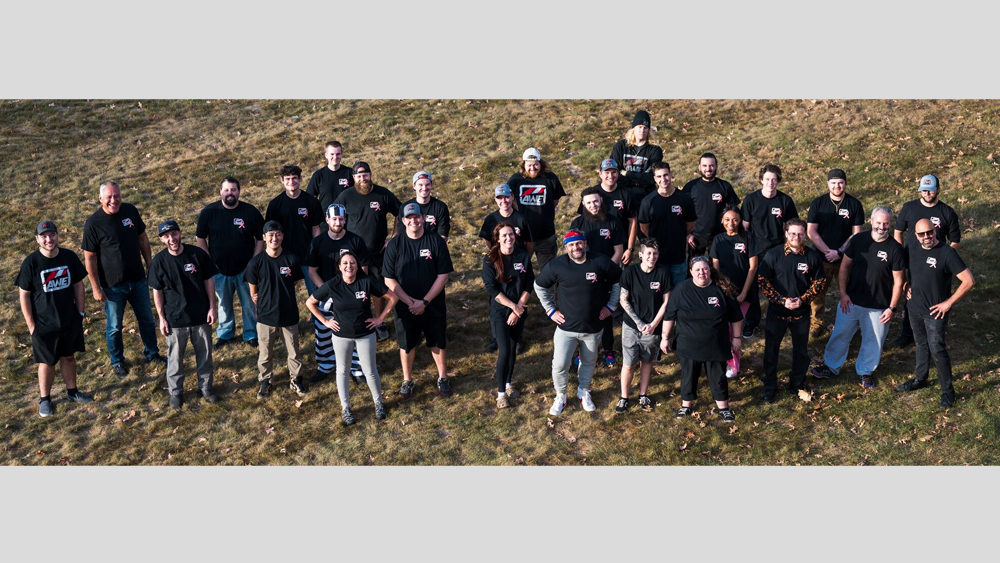 The people of AWE standing in field