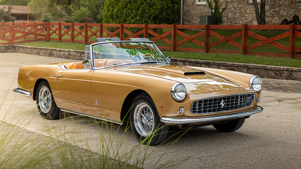 1962 Ferrari 250 GT Cabriolet Series II by Pininfarina parked in driveway in front of house
