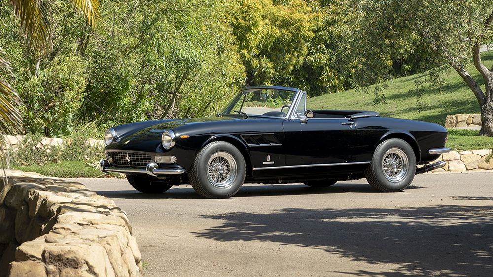 1965 Ferrari 275 GTS by Pininfarina parked on driveway surrounded by trees