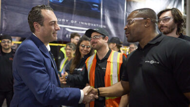 Antonio Filosa greets a Windsor Assembly Plant employee during an event celebrating Chrysler’s 100th anniversary
