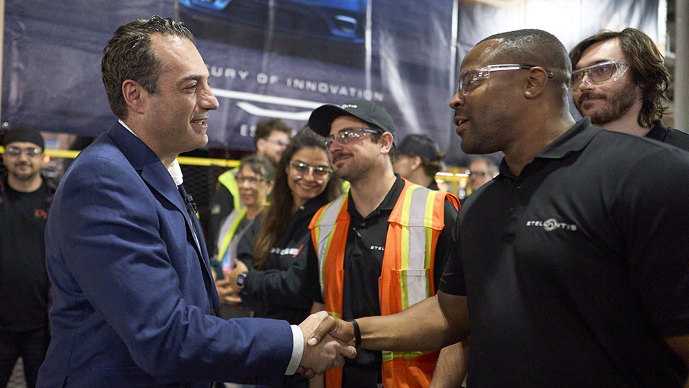 Antonio Filosa greets a Windsor Assembly Plant employee during an event celebrating Chrysler’s 100th anniversary