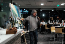 Bill Patterson during auction of one of his live paintings