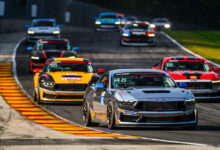 Cars racing on the Mustang Challenge course