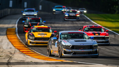 Cars racing on the Mustang Challenge course