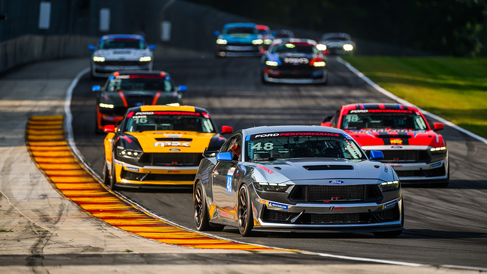 Cars racing on the Mustang Challenge course