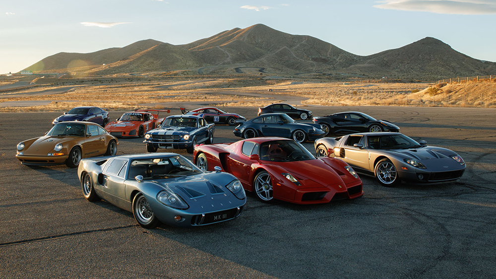 Collection of classic cars parked at Willow Springs Raceway