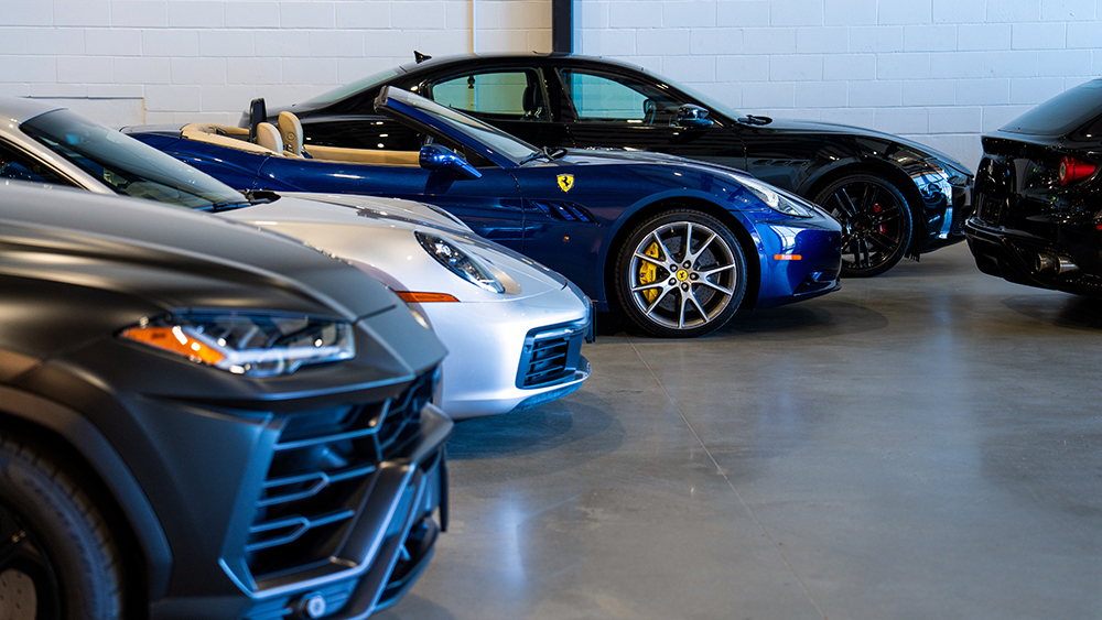 Collection of luxury cars in parking garage