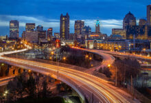 Columbus skyline at night with streaking car lights