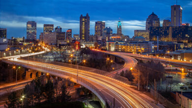 Columbus skyline at night with streaking car lights
